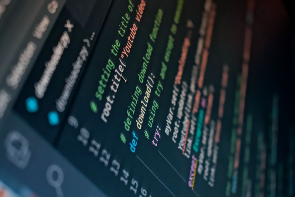 Close-up of source code being reviewed and optimised on screen